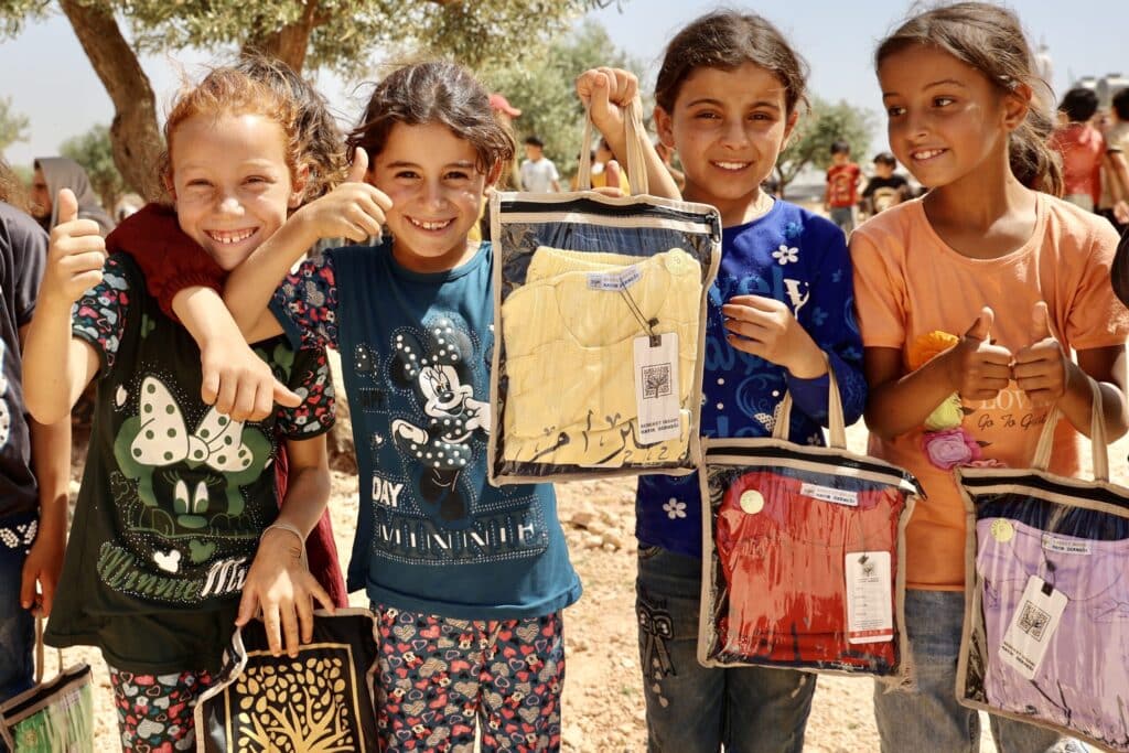 "Children receiving Bayram gifts in refugee camps"